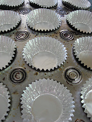Silver cupcake papers in muffin tin